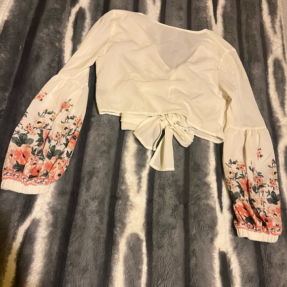 This is a sheer floral puff sleeve top. - Picture 2 of 3